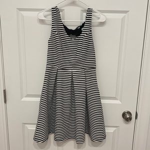 Black and white striped dress. Knee length. Size medium.